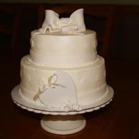 Img_1595_Small.jpg small wedding cake for friend-6" & 9" iced in butter cream w/ MMF accents-ceramic heart in front