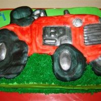 Tractor_Cake1.jpg Tractor cake for a 3 year old's birthday. The tractor is made out of fondant. I used the Wilton Tractor pan as a mold and then I...