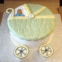 Baby Carriage Iced in buttercream and decorated with mmf and color flow.