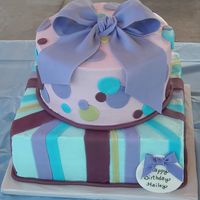 Purple & Blue Gumpaste bows, mmf decorations over buttercream. The birthday girl loves purple and blue.