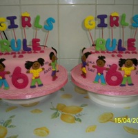 Twin Girls Rule Made the cakes for twin girls that turned 6...10" vanilla and strawberry cakes. Fondant and gum paste decoration.TFL.