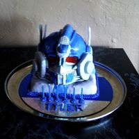 Transformer Cake This is a confetti cake with MMF frosting. It has rock candy eyes. The entire cake is edible with the exception of the blue ear pieces. You...