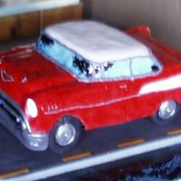 57 Chevy Cake For 50Th High School Reunion MMF, red velvet cake. buttercream icing, and rock candy for headlight covers. The headlights lit up!