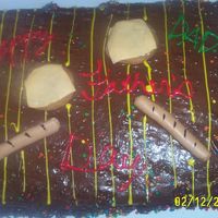 Father's Day Grill Chocolate cake, fudge frosting. The kids help me decorate it for dad with wilton icing writers. Hot dogs and cheeseburgers are from fondant...