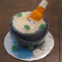 Corona Beer Cake This cake was a hard one. Putting the fondant only on the side wasn't the easiest thing....I think I did it the hard way. lol. Anywho...