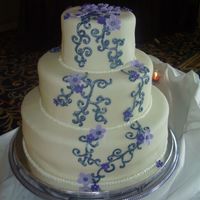 Pealry Blue And Purple Cake Another seriously time consuming cake, and we really underestimated that with this one. The flwoers took forever (all gumpaste with piped...