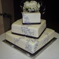 Silver Scrolls And Sparkles All MMF, with royal scrolls painted with silver lustre dust. And the topper was SO pretty (and I never like floral toppers) - sprayed with...