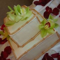 Bamboo And Orchids Buttercream iced with fondant bamboo, painted with a bit of gel colours mixed with clear vanilla. Actually, my first buttercream wedding...