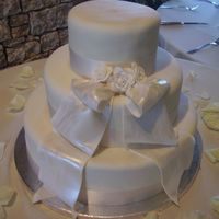 White Sash Cake I did this cake for a wedding that I was a bridesmaid in (not a good idea!) and I pretty much got to pick the design.The sash is a gumpaste...