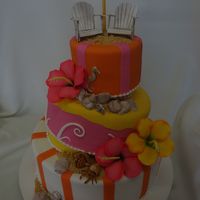 Whimsical Beach Cake Fondant Whimsical Cake with gumpaste chairs, umbrella, shells, and hybiscus