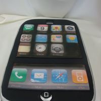 Iphone Full sheet cake cut into shape of phone covered in fondant. Buttons were edible images