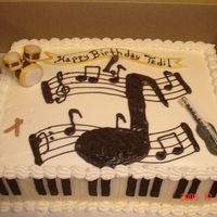 Musical Instruments Fondant piano keys for sides, drums, guitar, microphone and drum sticks. Buttercream icing