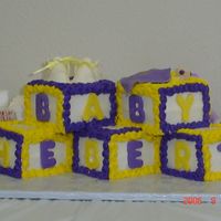 Lsu Baby Blocks Baby blocks in LSU colors. fondant booties. baby in blanket and letters. Buttercream icing