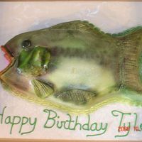 Bass Cake Sculpted out of a 9x13. Yellow cake with bavarian creme and strawberry filling Buttercream icing. Fondant accents and airbrushed next time...