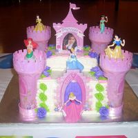 Castle Cake Castle Cake for my grandaughter's 4th Birthday. Coconut flavored white cake with buttercream frosting and roses. The castle part was a...