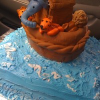 Noah's Ark Baby Shower Baseis buttercream, Ark and animals are all fondant. It is not asclean as i would have liked but the fondant was not cooperating.