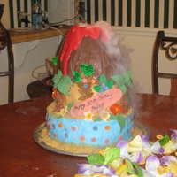 Volcano Luau 30th birthday luau smoking volcano,...volcano is RKT covered in chocolate w/ a glass jar inside that held the dry ice and water....
