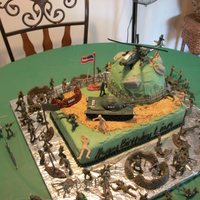 Army Cake buttercream with my son and hubby's placement of plastic soldiers. My son was very excited to be able to create his own battlefield in...