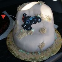 Daniel's Sand Dune Quad Cake Sand dune with wheat and segrass, chocolate transfer of him on his quad jumping a dune, flag is just paper taped on wire;-)