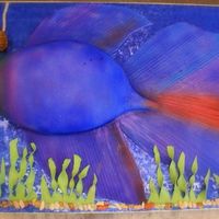 Betta Fish Cake Fondant covered fish cake, seaweed is fondant, chocolate rocks, hook and sign are also fondant.;-)