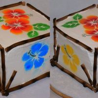 Hawaiian Themed Birthday Cake Fondant bamboo airbrushed, I made the hibiscus stencil myself and airbrushed the flowers onto a chocolate cake separated by ganache and...