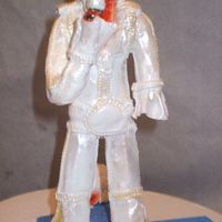 Elvis This is a sculpture of Elvis I made on a wire frame. His head is not on yet. This is made out of gumpaste.