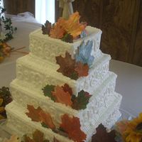 Fall Square 4 Tier Wedding Cake This is a fall wedding cake I made using the sugar leafs I previously showed. It is a 4 tier wedding cake with butter cream frosting.