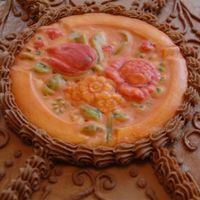 Top Of Cake Sugar Cookie made with a mold then frosted and painted with food coloring.