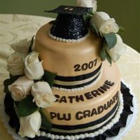 Graduation Cake This Cake was done in the College Graduates colors and was done in fondant and real flowers. I found this cute cap at the party store.