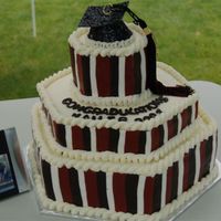 Kailebs Graduation This cake was made with butter cream and then the sides are stripes of fondant. It was put together and taken some 400 miles to my nephews...