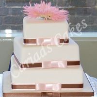 Square Offset Cake This cake is simple in design. Just by setting each tier at different angles and adding 2 colours of ribbon give this cake a sophisticat...