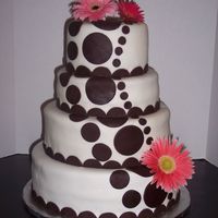 Path Of Life Classic white cake with BC filling and covered in MMF, modeling chocolate decorations. Real gerberas from my own flower garden.