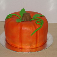 Pumpkin Two bundt cakes, chocolate WASC and vanilla almond with buttercream. Airbrushed electric orange with lemon yellow highlights and fondant...