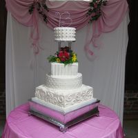 Burton Wedding Cake WASC cake with buttercream icing; 14" square with random swirls, 12" round diamond pattern, 8" square with stripes, and 6&...