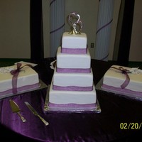 Delailah Vanilla cake with strawberry preserves and vanilla buttercream filling. All butter buttercream and fondant icings. Gum paste calla lilies...