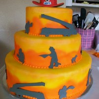 Fireman Groom German chocolate cake with all butter buttercream and fondant icings. Each tier was air brushed to create the flame background, shadows are...