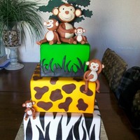 Monkey Babies Vanilla cake with all butter buttercream and fondant icings. Monkeys are fondant and tree shadow topper is gum paste. (My version of a...