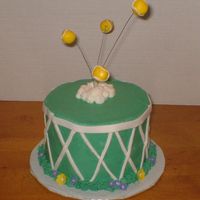 Tennis Cake This is a small 6" French Vanilla cake frosted in Butter cream with fondant accents.