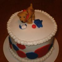 Dog And Toys This is a 6" white cake with BC frosting. All decorations are fondant. It was made for a friend to take to a cake walk at their church...