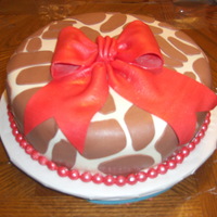 Victoria's Babyshower The baby's bedding is giraffe print with red accents.