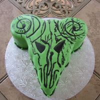 Pick Of Destiny birthday cake for my grandson. he wanted a cake that looked like his guitar pick. sculpted and covered with fondant. hand painted design