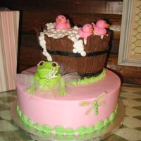 Frilly Frog And Baby Ducks 10" strawberry and 6" chocolate iced in buttercream w/ fondant accents and hand moulded frog and ducks , chocolate planks on...