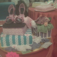 Engagement Cake For Auction Cake made for auction for engagements, shoe boxes and shopping bag, with gumpaste flowers and shoes, border punch lace...not very good...