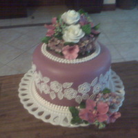 Single Tier Purple Wedding Cake One tier almond cake covered in MMF and decorated with gumpaste orchids, roses and hydrangeas...(bride only wanted one tier). Sorry the...