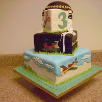 3 Year Old Birthday Haircutting Ceremony Cake Another cake for a three-year-old boy on his birthday getting his first haircut. Used embossers to make the train and airplane and clouds...