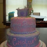 Tinker Bell white cake with fresh strawberry filling. fondant and buttercream