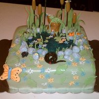 Reptile Pond Scene Chocolate cake with chocolate ganache filling. covered with MMF all pieces are MMF except for the cat tails and tall grass which are made...