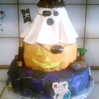 Halloween Pirate Cake I made this for my husbands work! All the managers at his work are dressing up as pirates so thats why its a Halloween pirate cake. I...