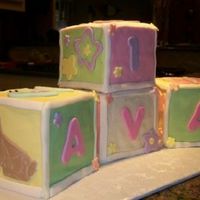 Ava's 1St Birthday Blocks Four 5" block cakes covered in fondant with fondant cutouts.