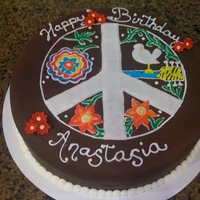 Peace Sign 40th Birthday cake. Client wanted the Woodstock bird, non-traditional flowers and peace sign. The flowers came from a pattern in Colette...